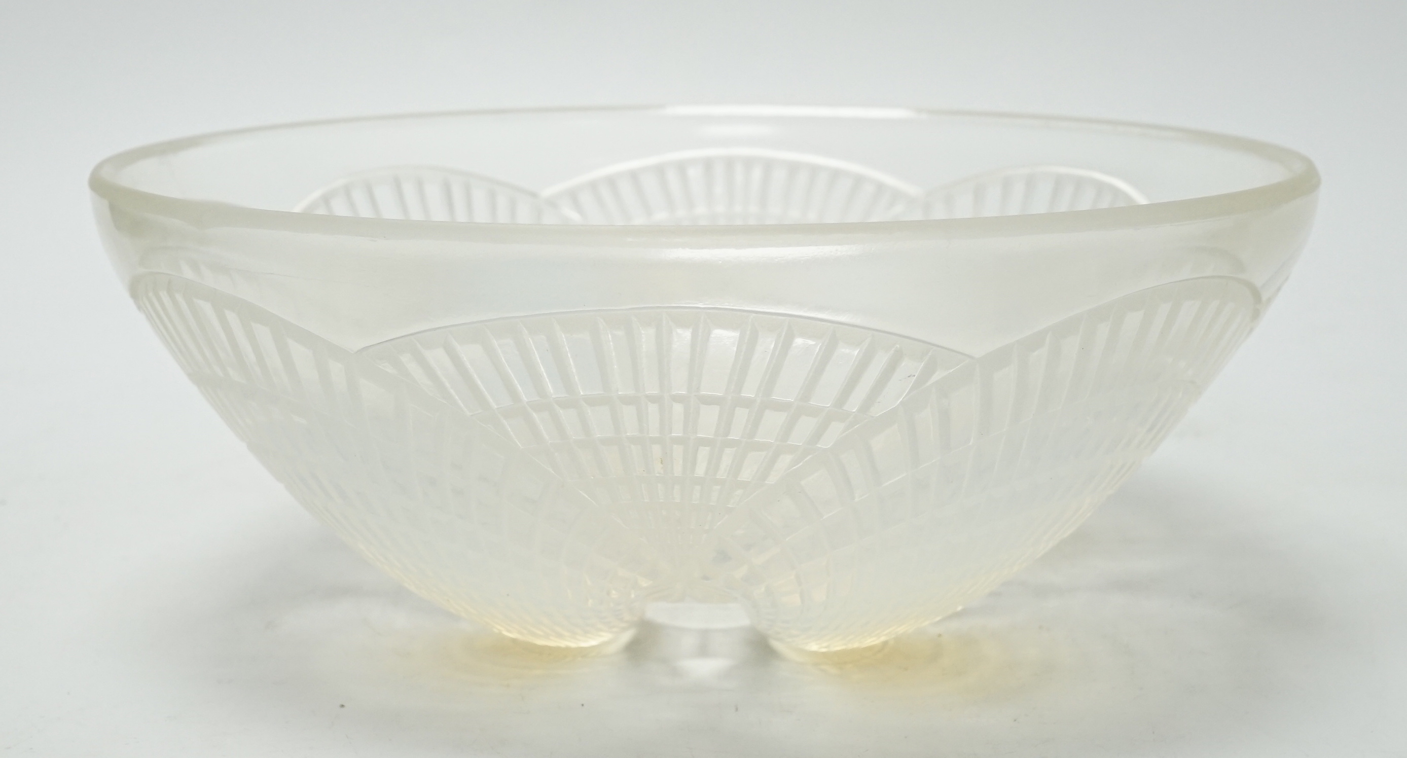 A Lalique opalescent glass Coquilles pattern bowl, moulded ‘’R. LALIQUE’’ mark, 21cm wide